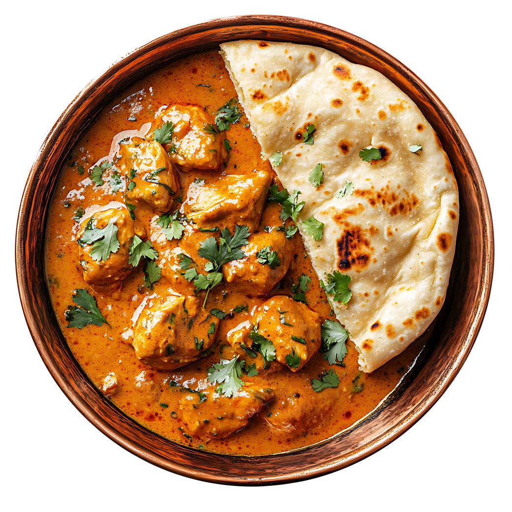 Chicken tikka masala in a copper bowl with naan bread, garnished with cilantro.