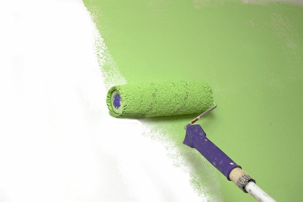 Wall Getting Painted with Green Colour — Painters in Goonellabah, NSW