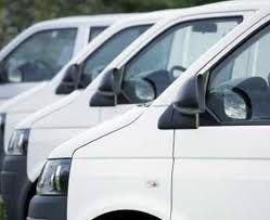 White vans parked in a row.