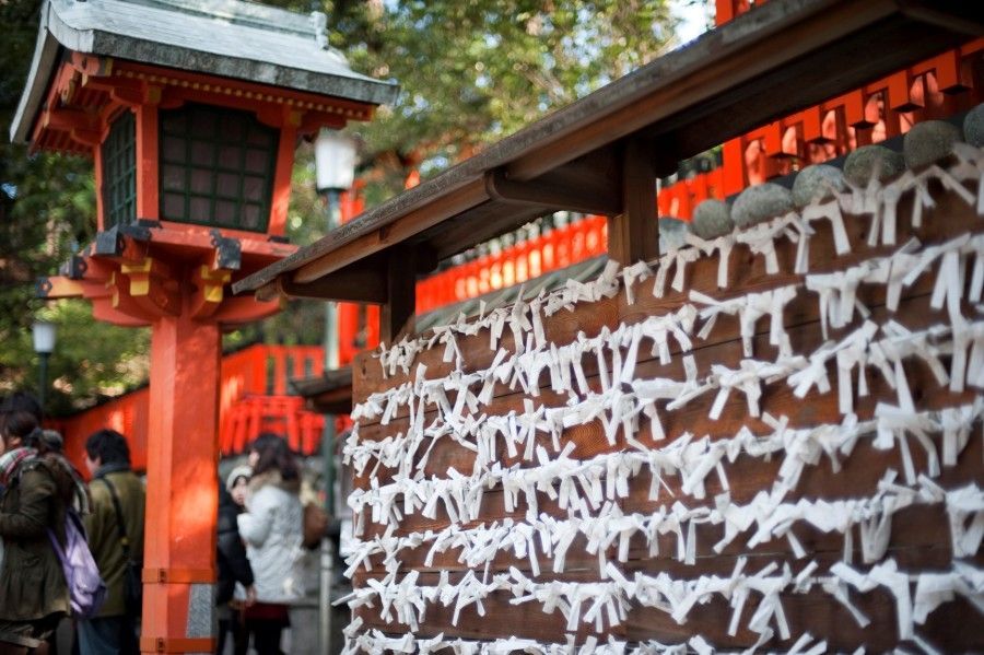 Hatsumode Omikuji fortune papers on a board at a shrine