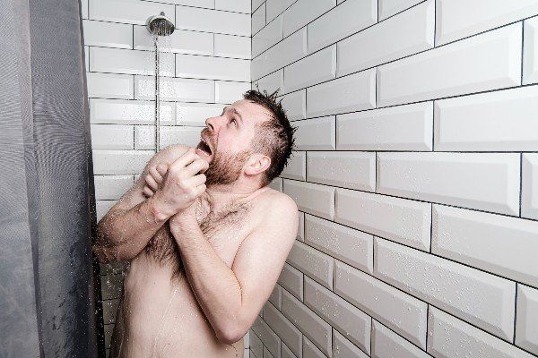 Man in cold Japanese bathroom/shower