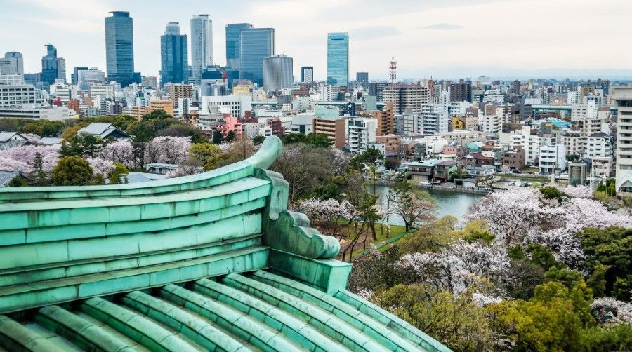 A view of a city from the top of a building.