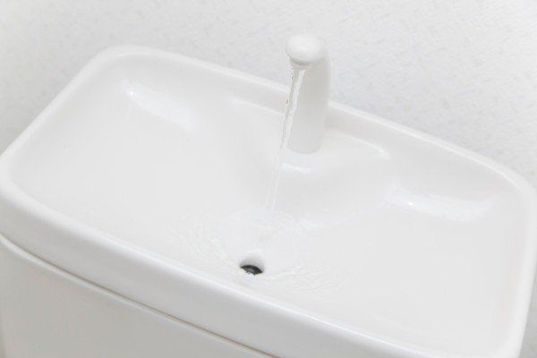 Sink for hand washing on toilet tank