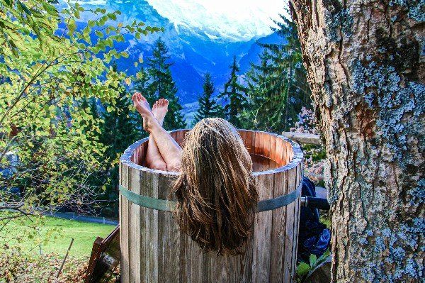 Woman in cool outdoor bath