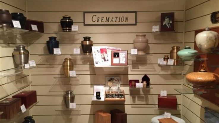 there are many different types of urns on display in this room .