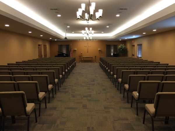 a row of chairs are lined up in a room .
