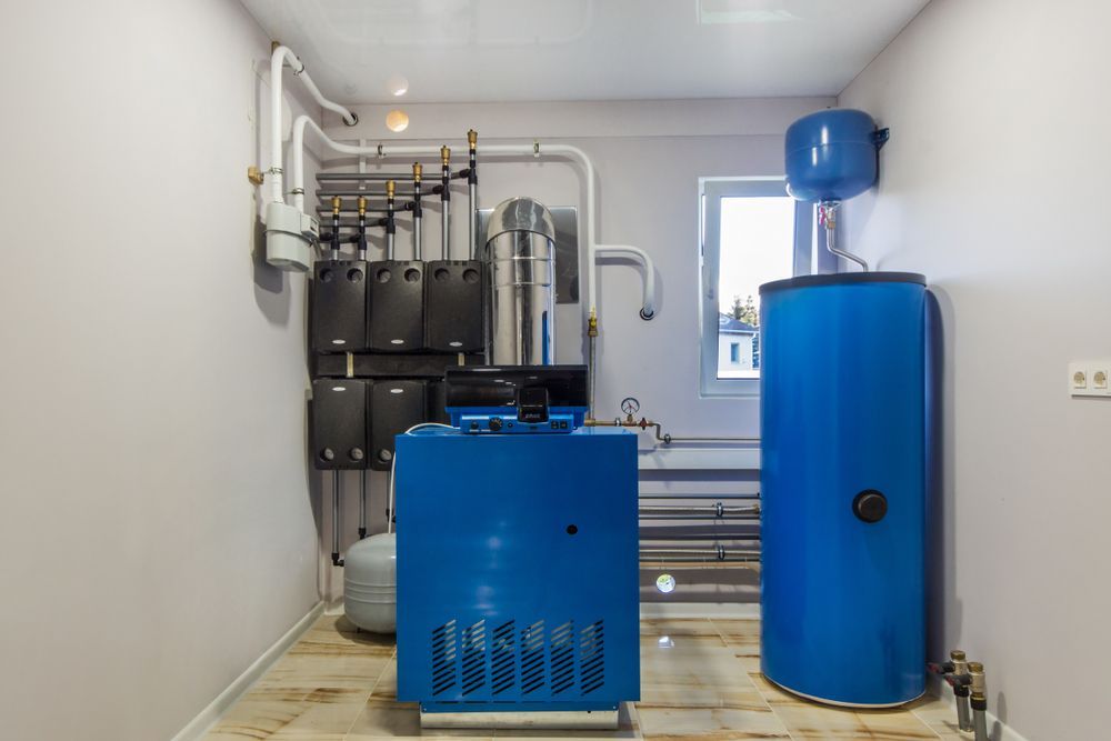 Blue Heating System Equipment in a Utility Room — Waves Plumbing in Lake Macquarie, NSW