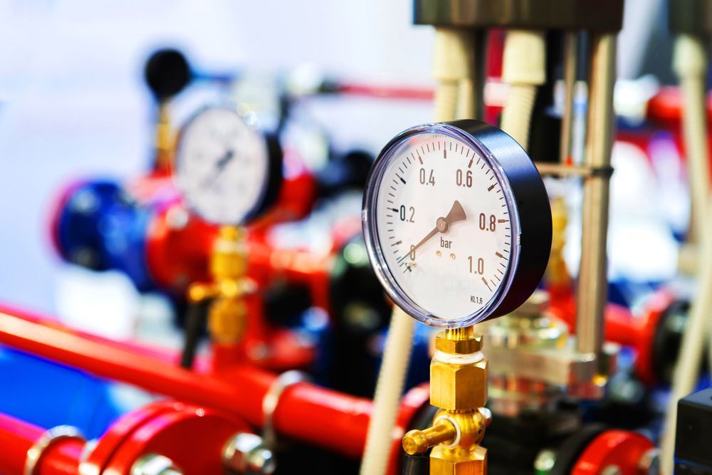 Pressure Gauges on Red and Blue Pipes — Waves Plumbing in Gosford, NSW