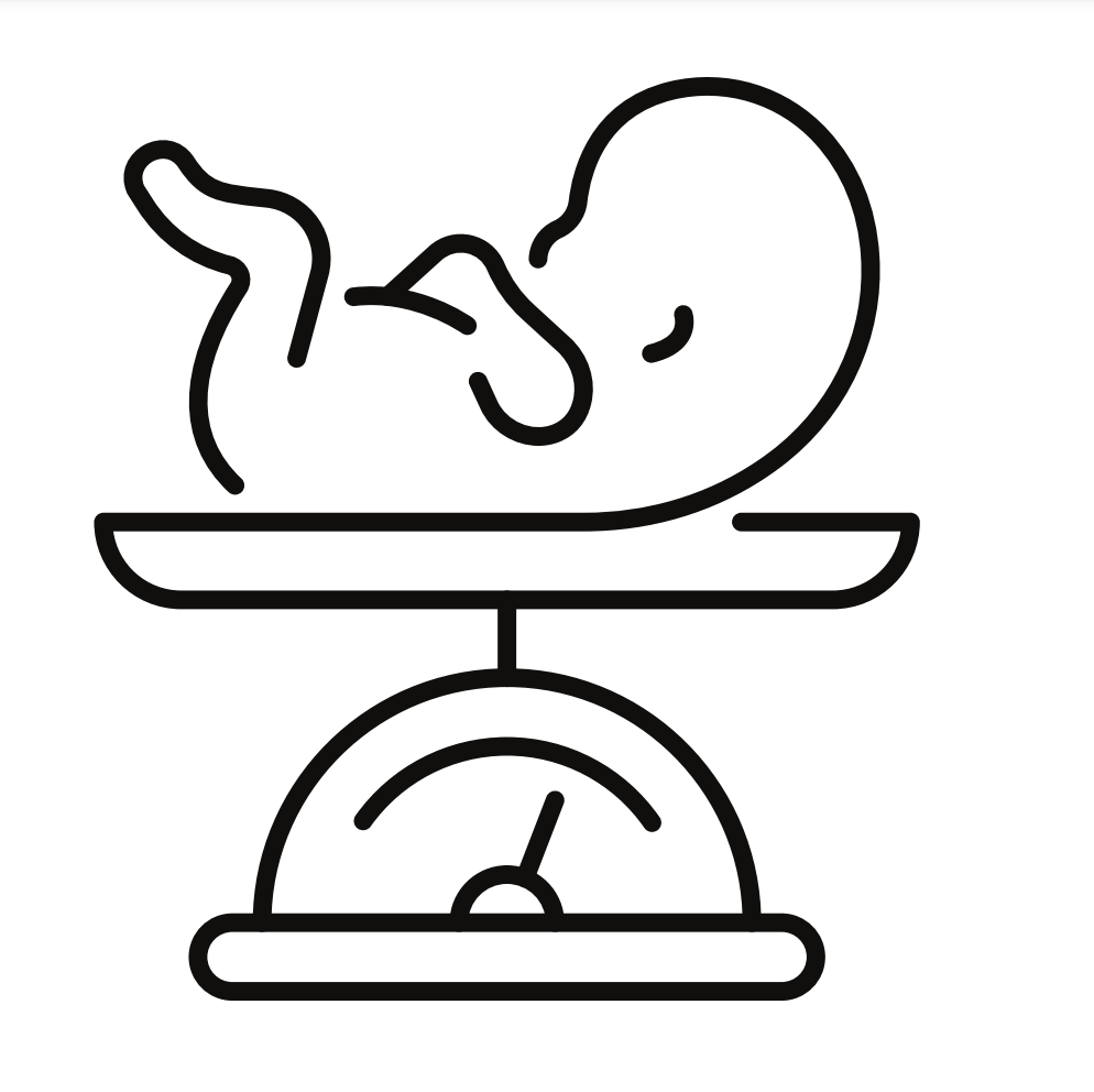 A baby is being weighed on a scale.