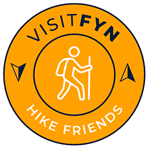 Et logo for visitfynske vandrevenner med en pindefigur vandring