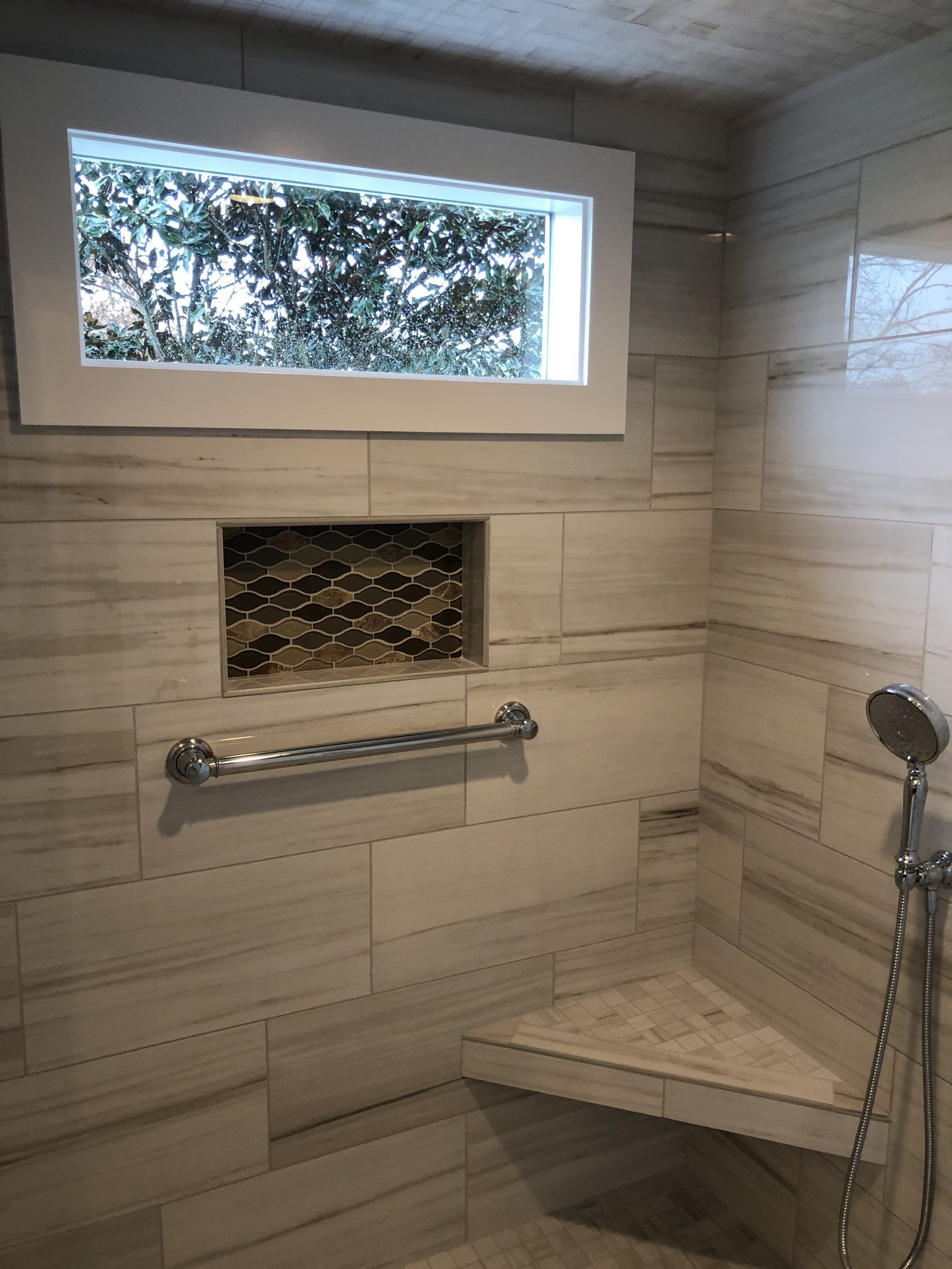 A Shower with A Window and A Bench and A Shower Head | Tonao, VA | Don Kendrick