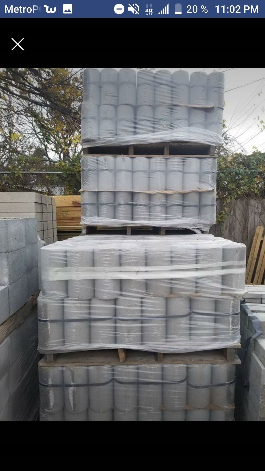 A pile of concrete blocks stacked on top of each other on pallets.