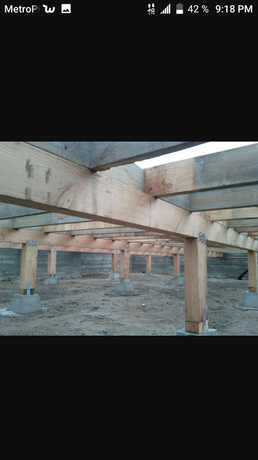 A picture of a wooden structure being built on a cell phone.
