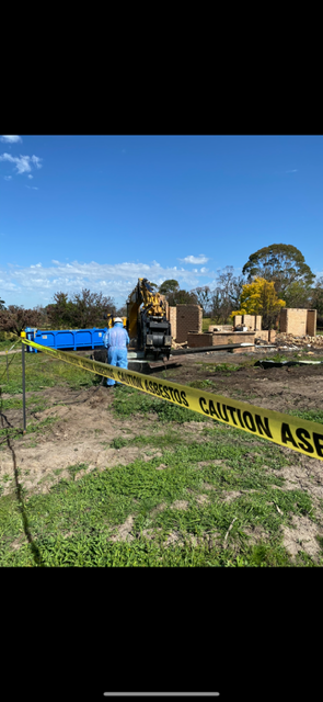A construction site with a yellow caution tape around it.