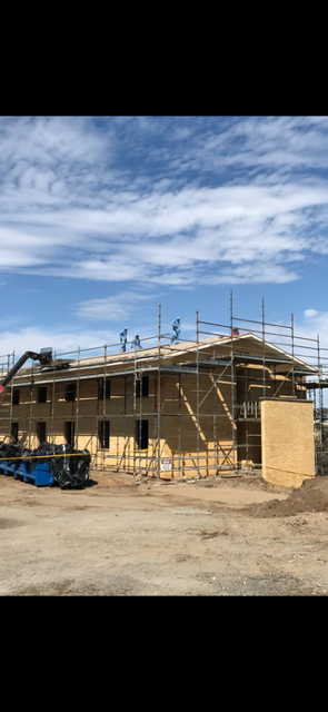 A large building is being built with scaffolding around it.
