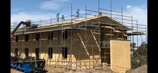 A building is being built with scaffolding around it.