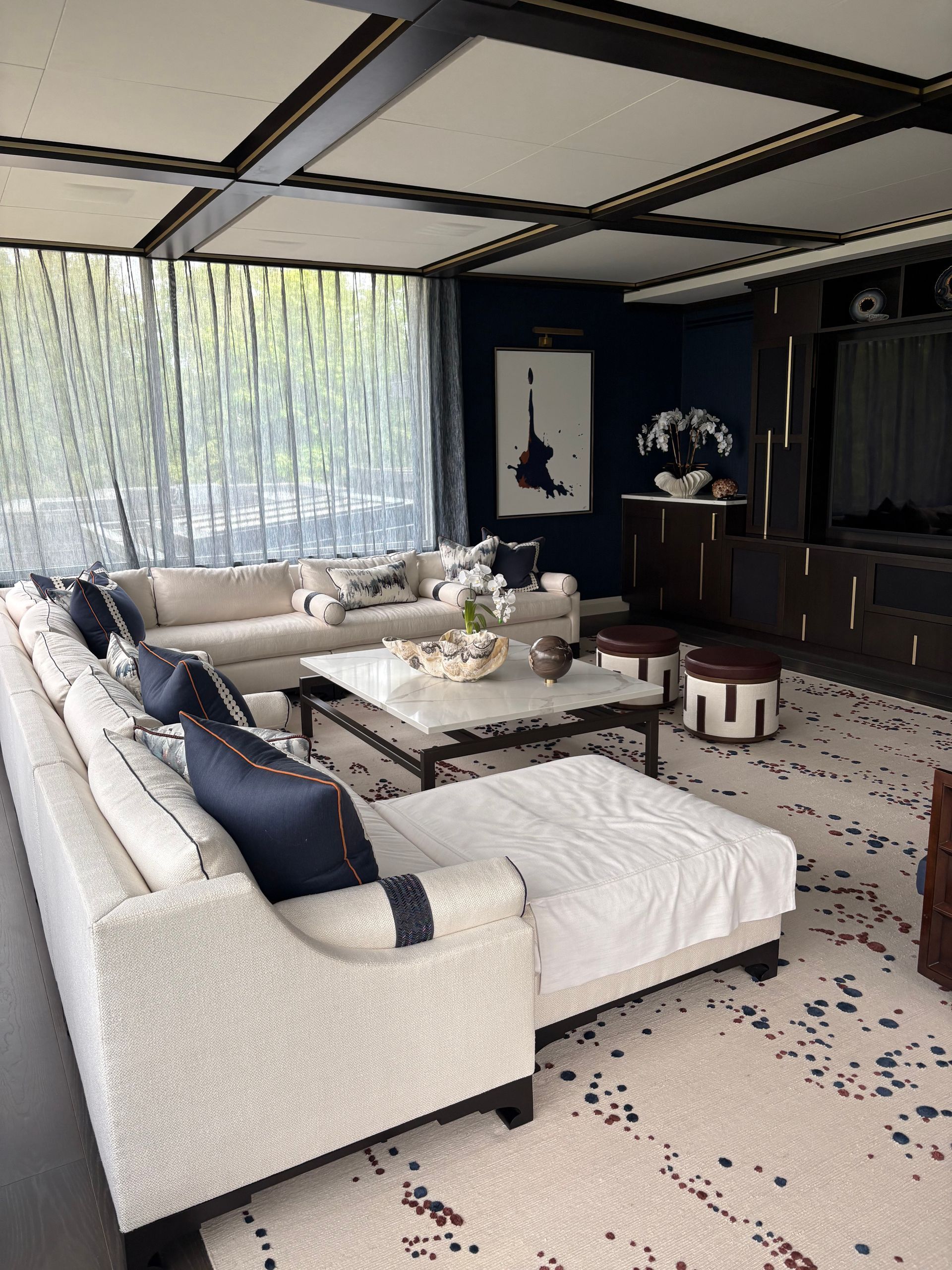 A living room filled with furniture and a large window.