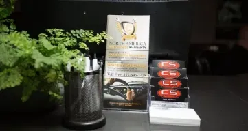 A table with a plant and a sign that says north america