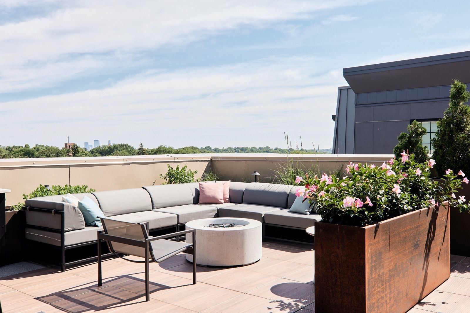 Rooftop fire pit lounge with views of downtown Minneapolis