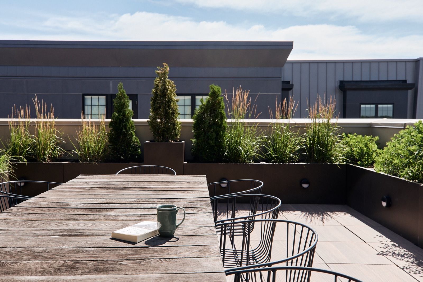 Rooftop dining area with seating for ten people