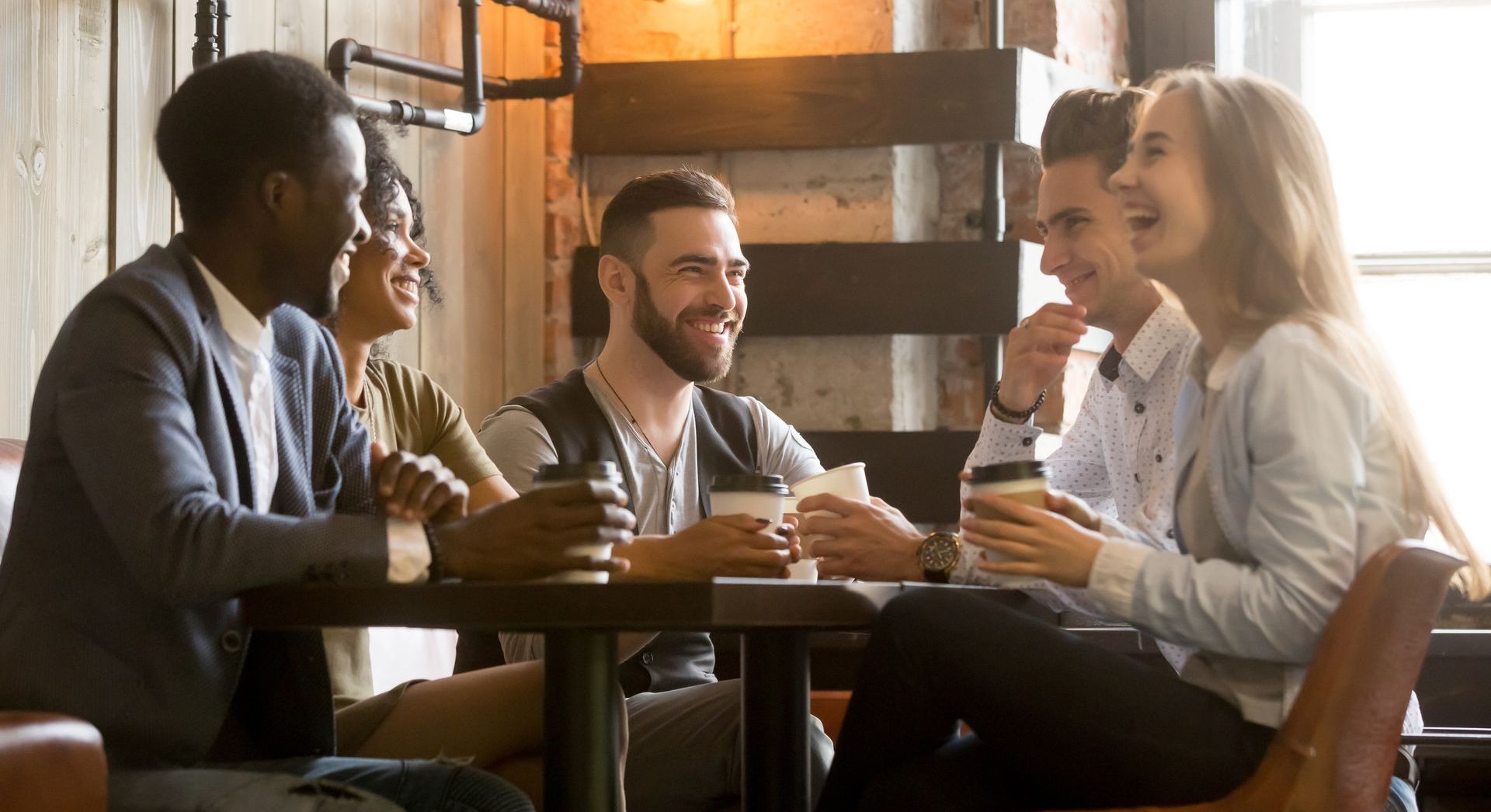 Business people sitting at table with coffee