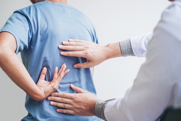 Patient having a back pain checkup — Jersey City, NJ — Pain and Disability Institute