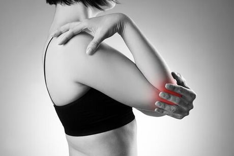 Woman with elbow pain — Jersey City, NJ — Pain and Disability Institute