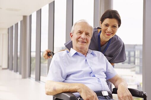 Nurse with an elderly patient — Jersey City, NJ — Pain and Disability Institute