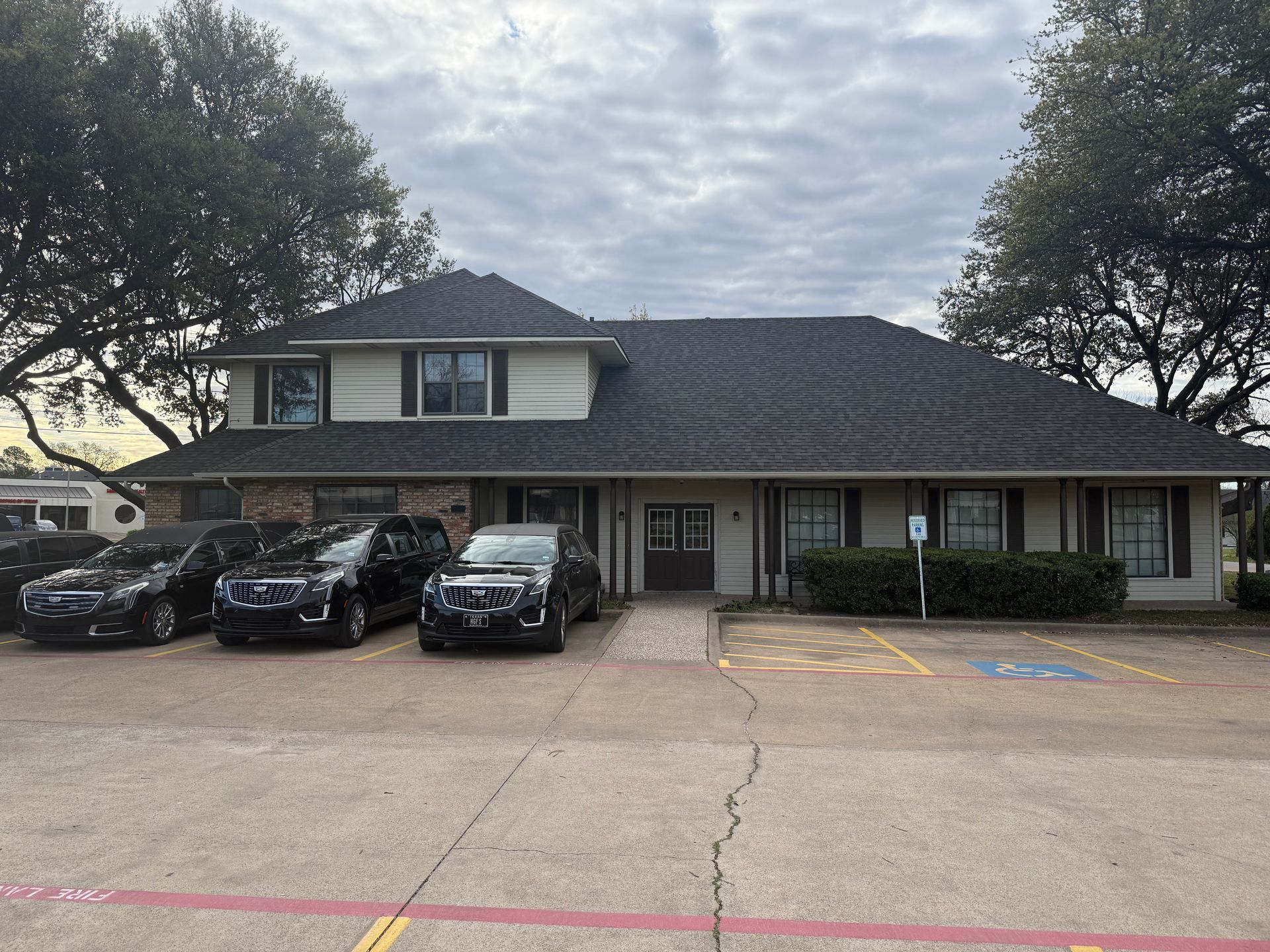 A large office building with a lot of windows on a sunny day.