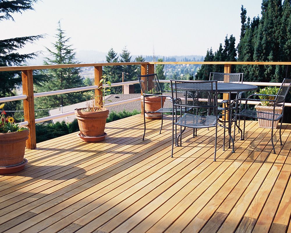Metal table and chairs on a custom deck, perfect for outdoor dining and relaxation | Mechanicsburg, 