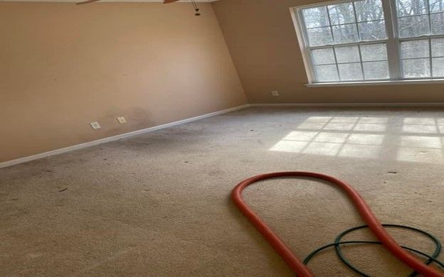 There is a hose in the middle of the room.