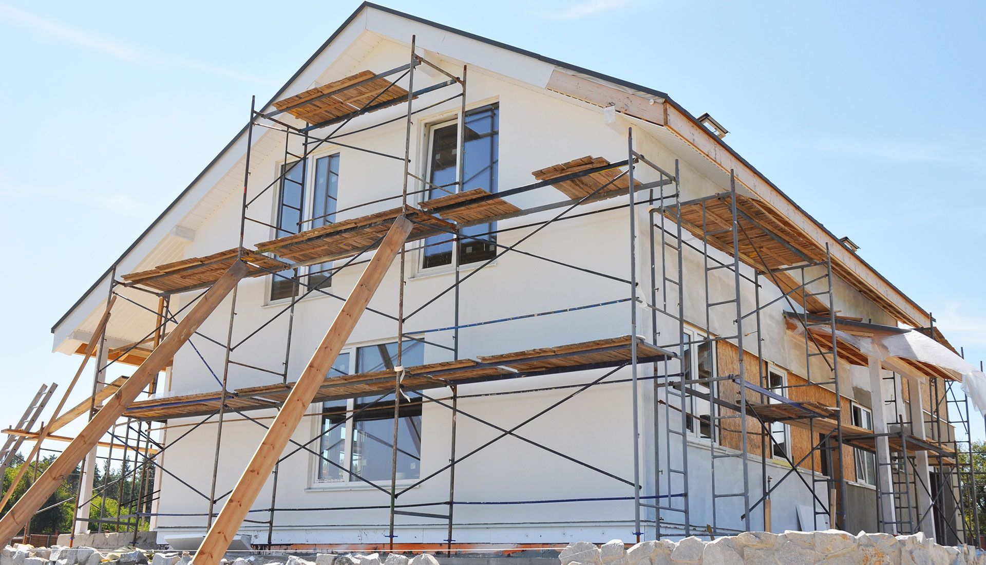 A house is being built with scaffolding around it.