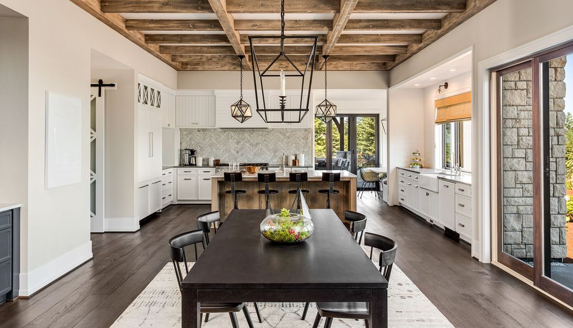 There is a large dining table in the middle of the room.