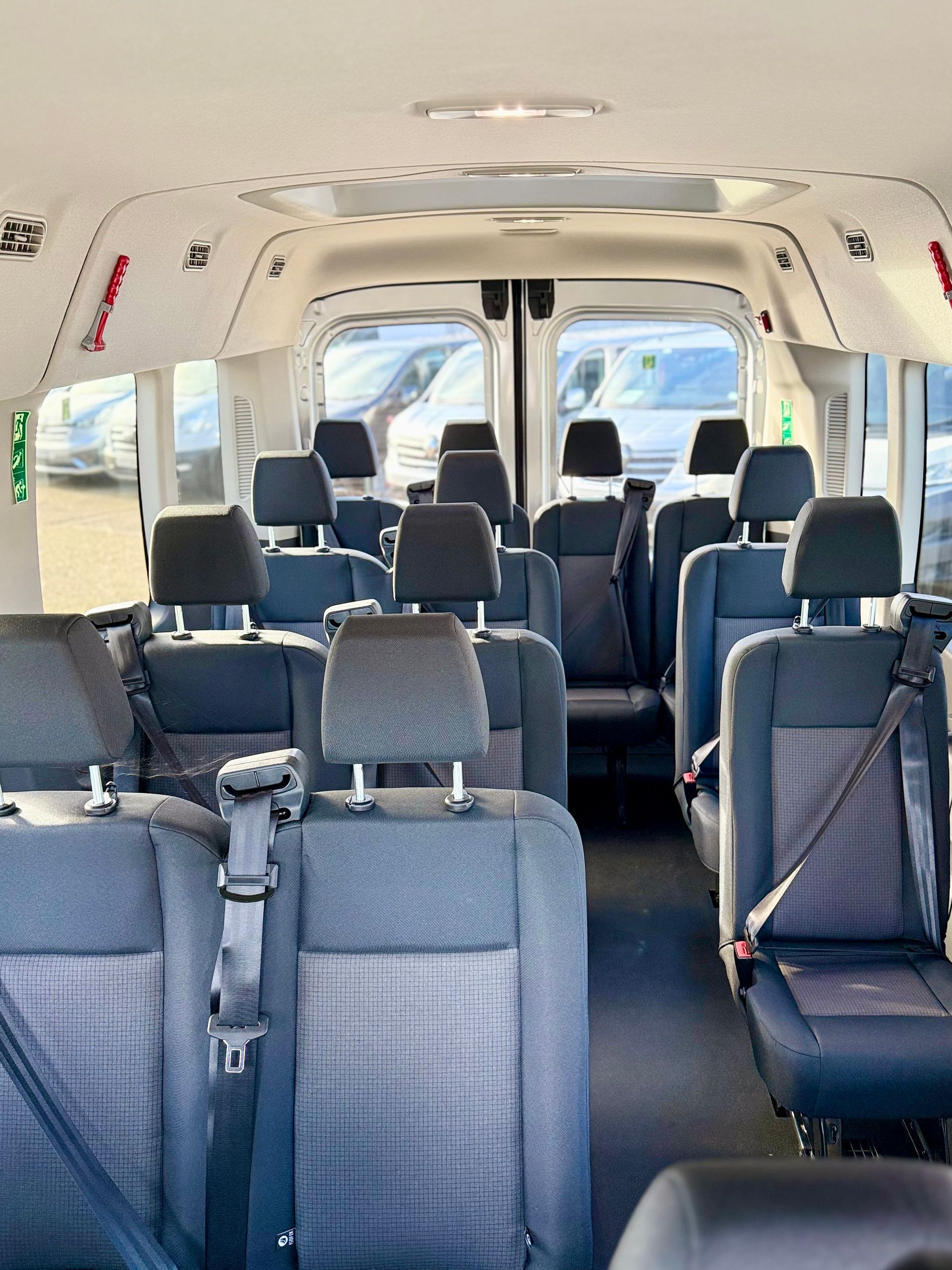 minibus hire with 14 and 15 seats perfect for holidays, wedding, transporting staff, hen do, stag do, events, minibus rental you can drive yourself, UK and European travel, ford transit