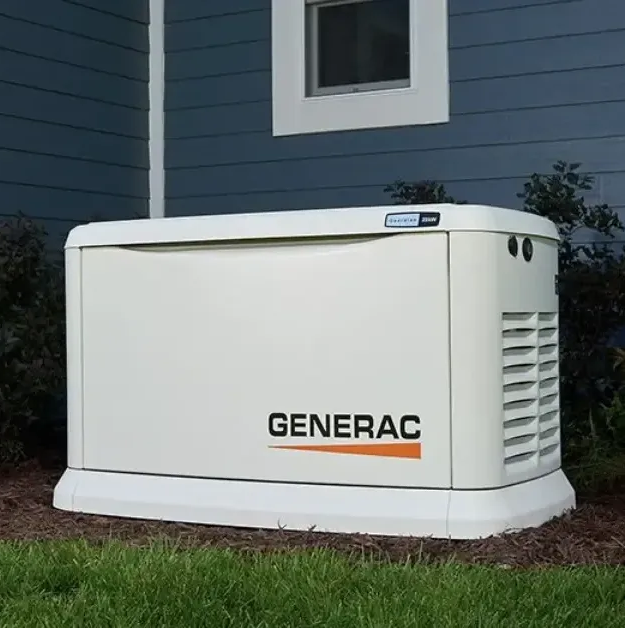 A beige Generac standby generator positioned outdoors in front of blue siding and a small window.