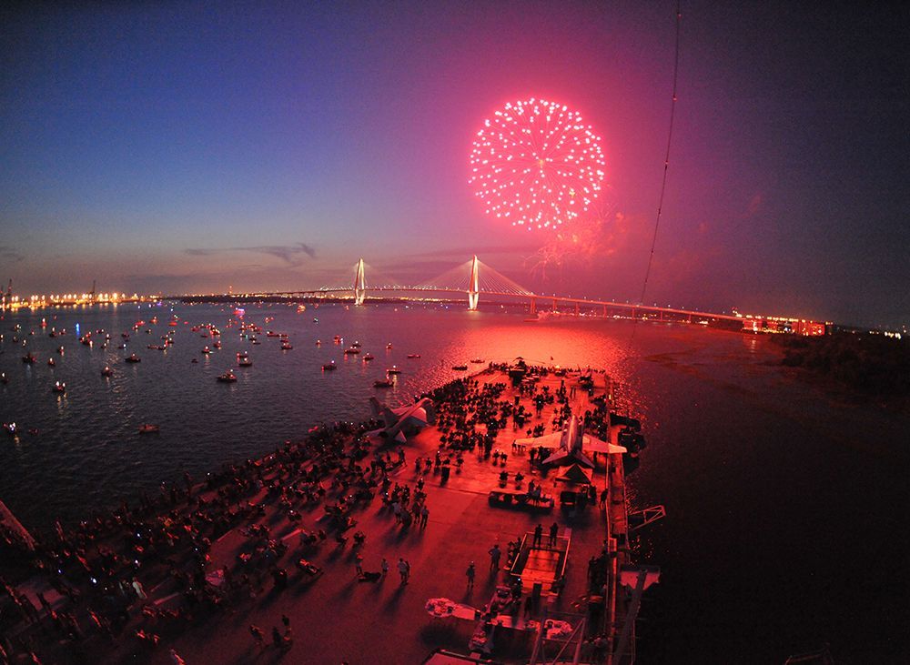 Crowds watching Fourth of July fireworks at Riverfront Park, Charleston area