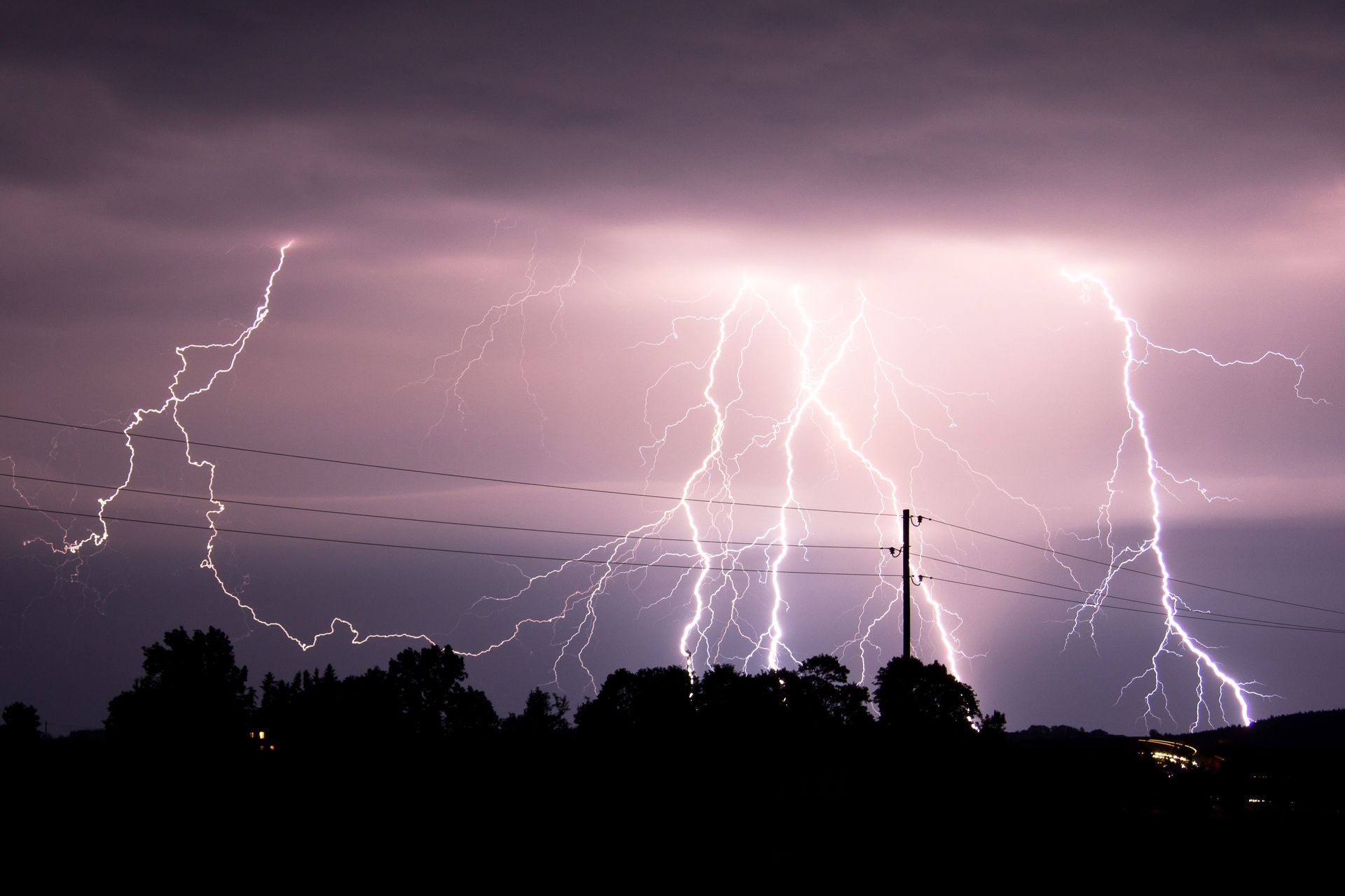 Severe storm with lightning over a South Carolina neighborhood—reminder of seasonal power surge risk