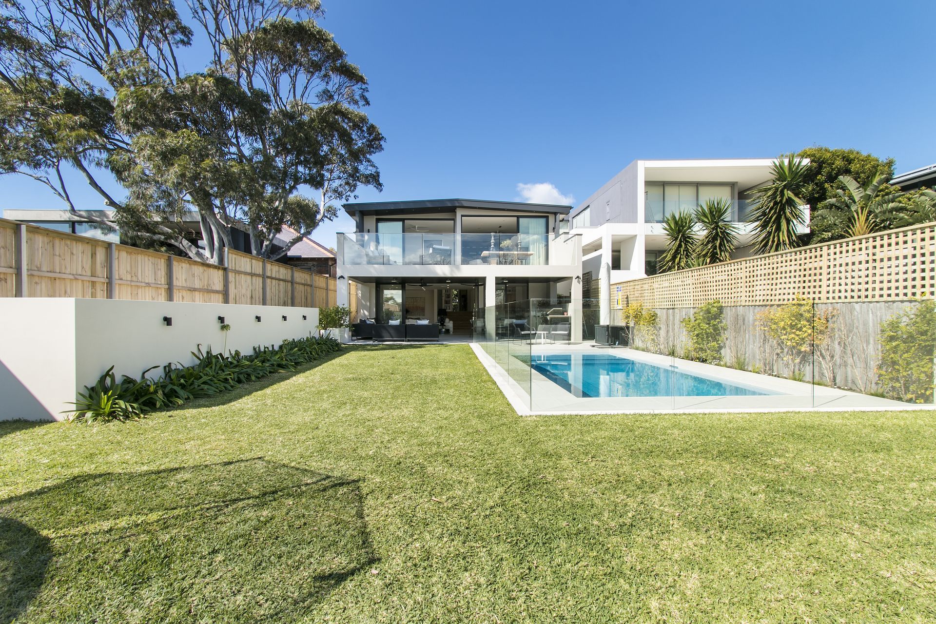 A Modern House With a Pool and a Grassy Backyard — Get My Pool Certified in Burleigh Waters, QLD
