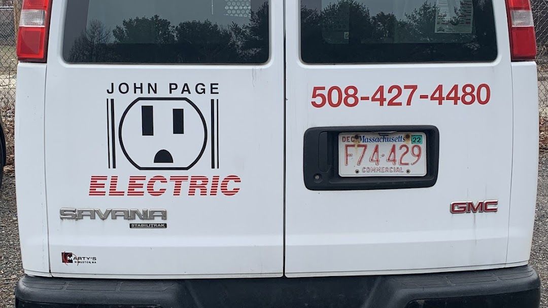 A white van with a sticker on the back that says john page electric