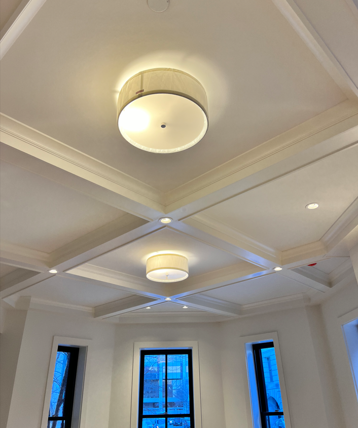 A room with a ceiling that has a light on it