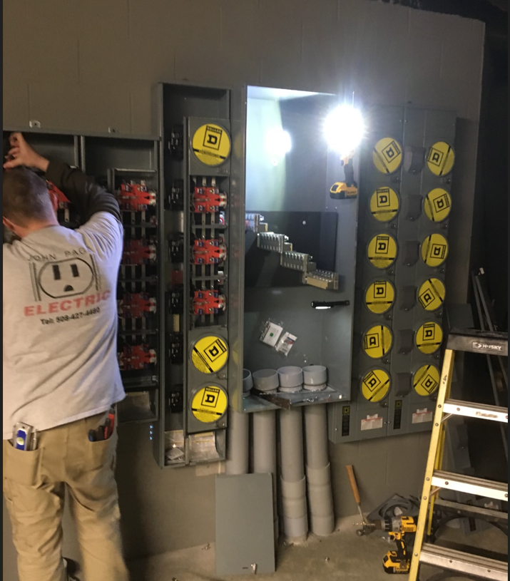 A man wearing a shirt that says electric on it