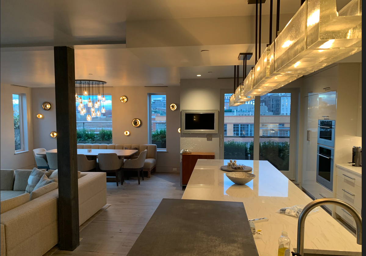 A kitchen with a large island in the middle of the room