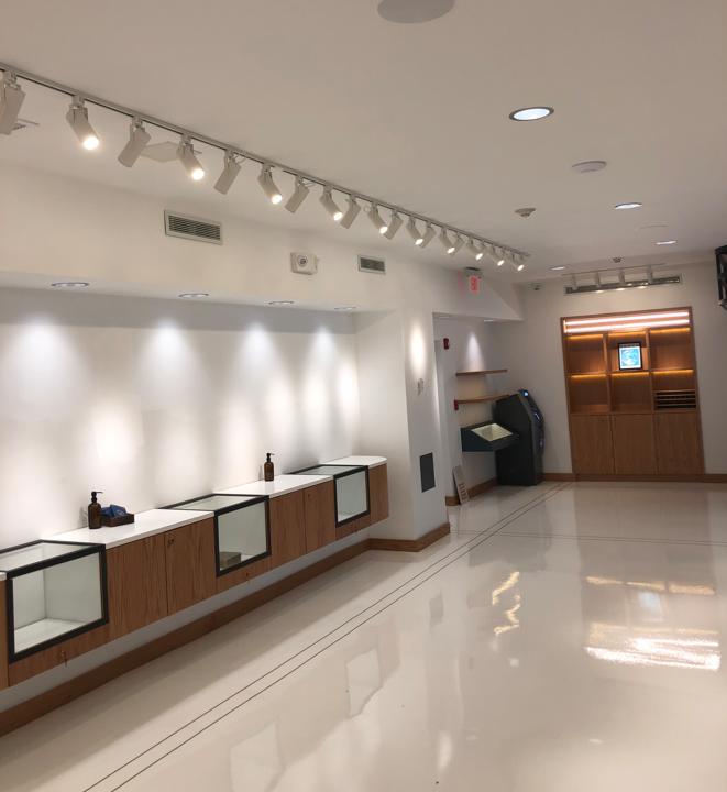 A large room with a lot of lights on the ceiling