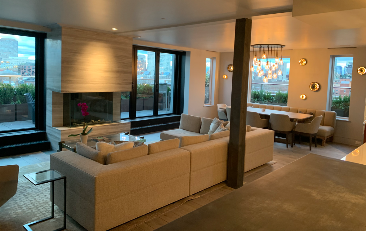 A living room filled with furniture and a fireplace.