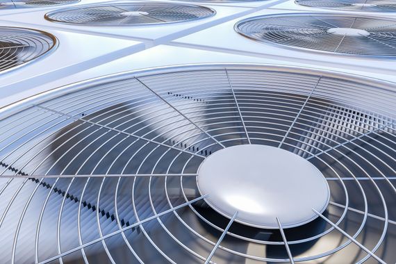 A close up of a fan on a ceiling.