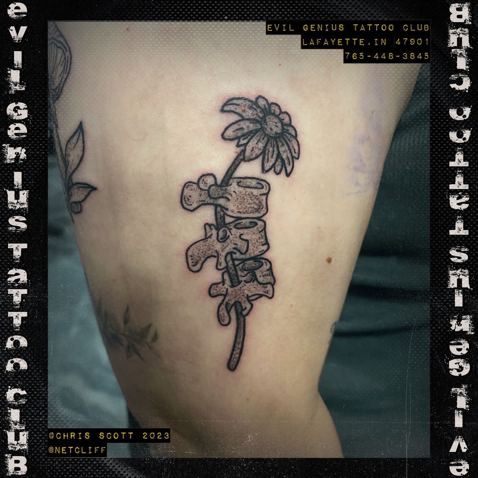 spinal cord daisy tattoo by Chris Scott