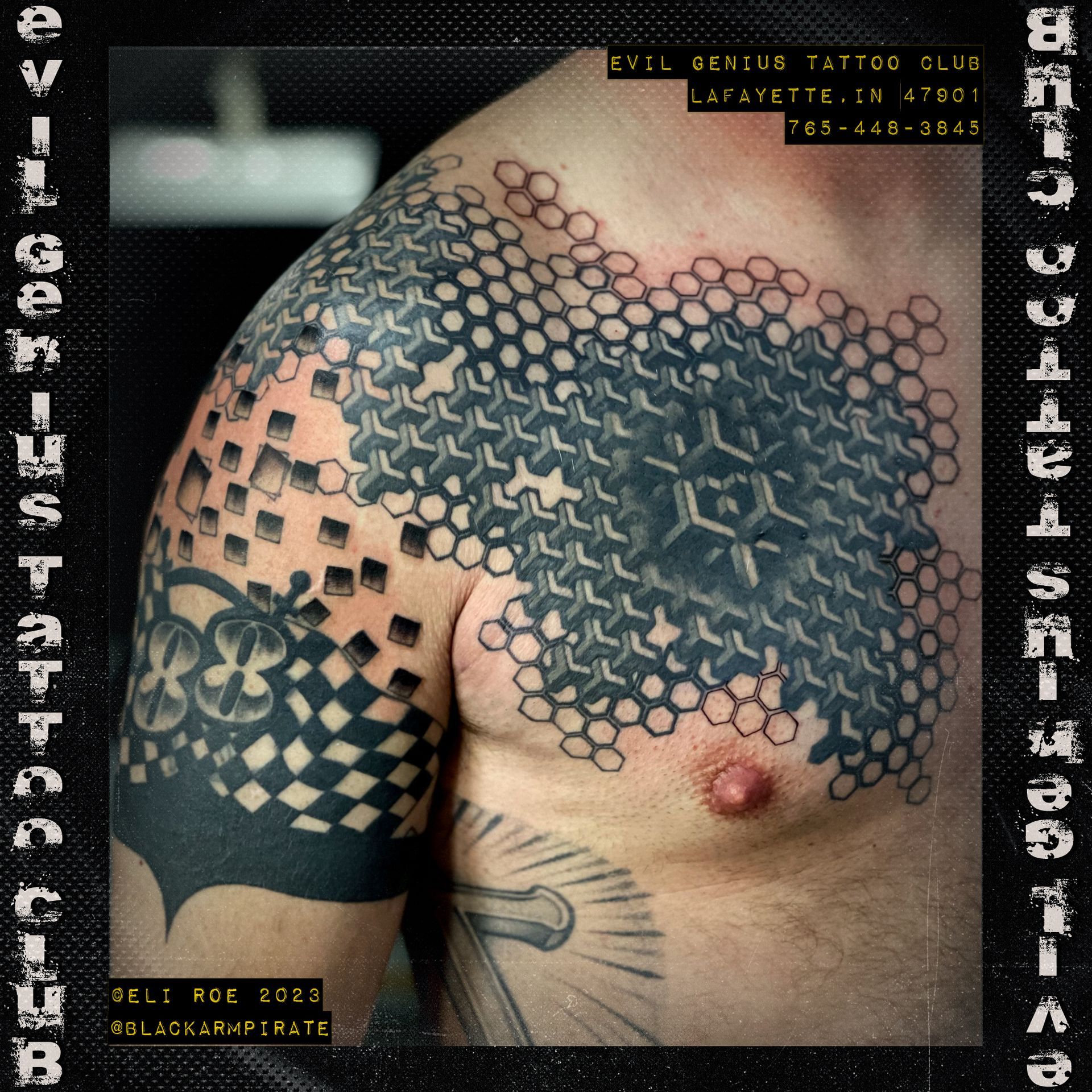 geometric chest piece tattoo by Eli Roe