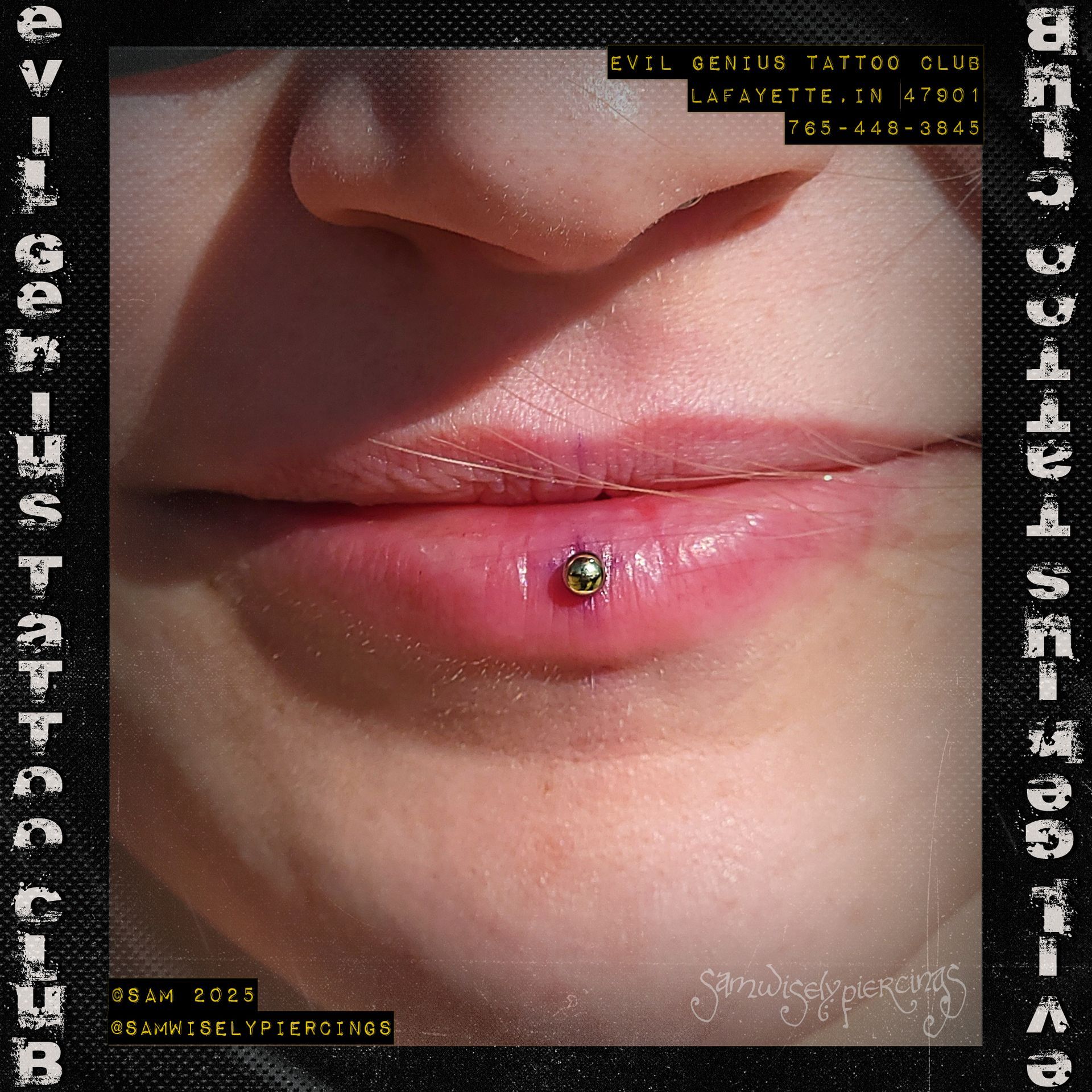 Close-up of a person's lower lip with a fresh lip piercing, performed by Sam. 