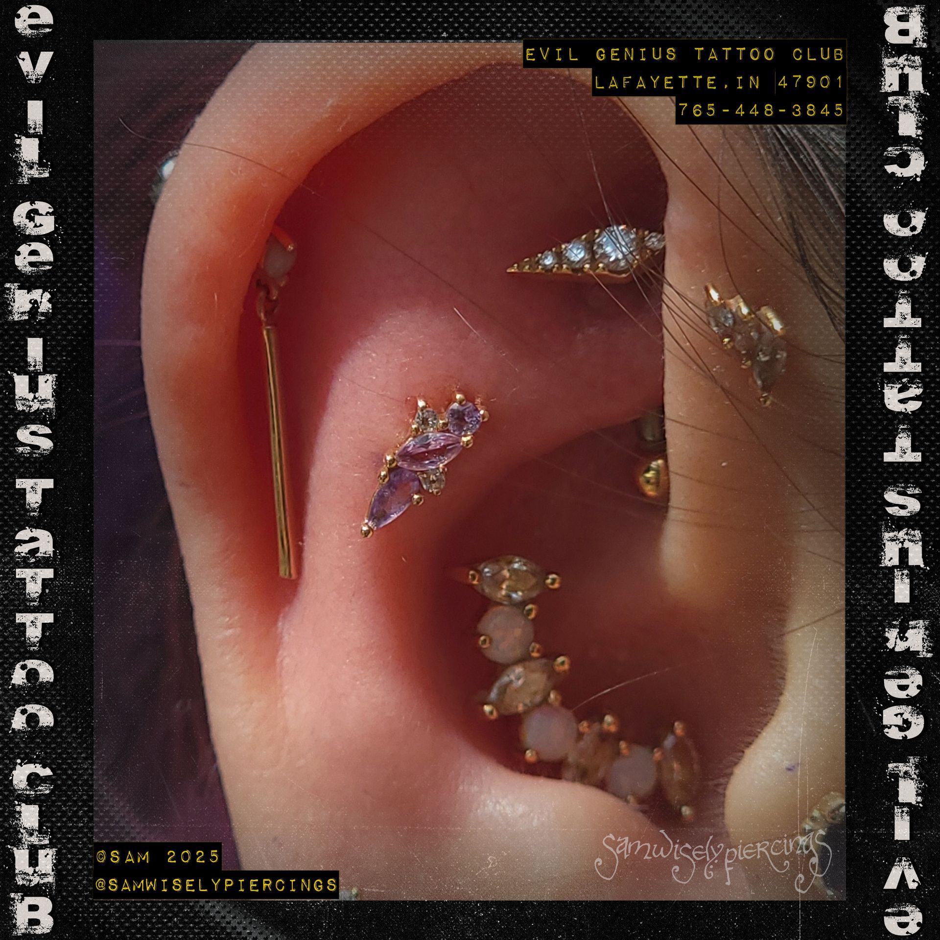 Close-up of an ear adorned with various gold and jeweled piercings curated by Sam.