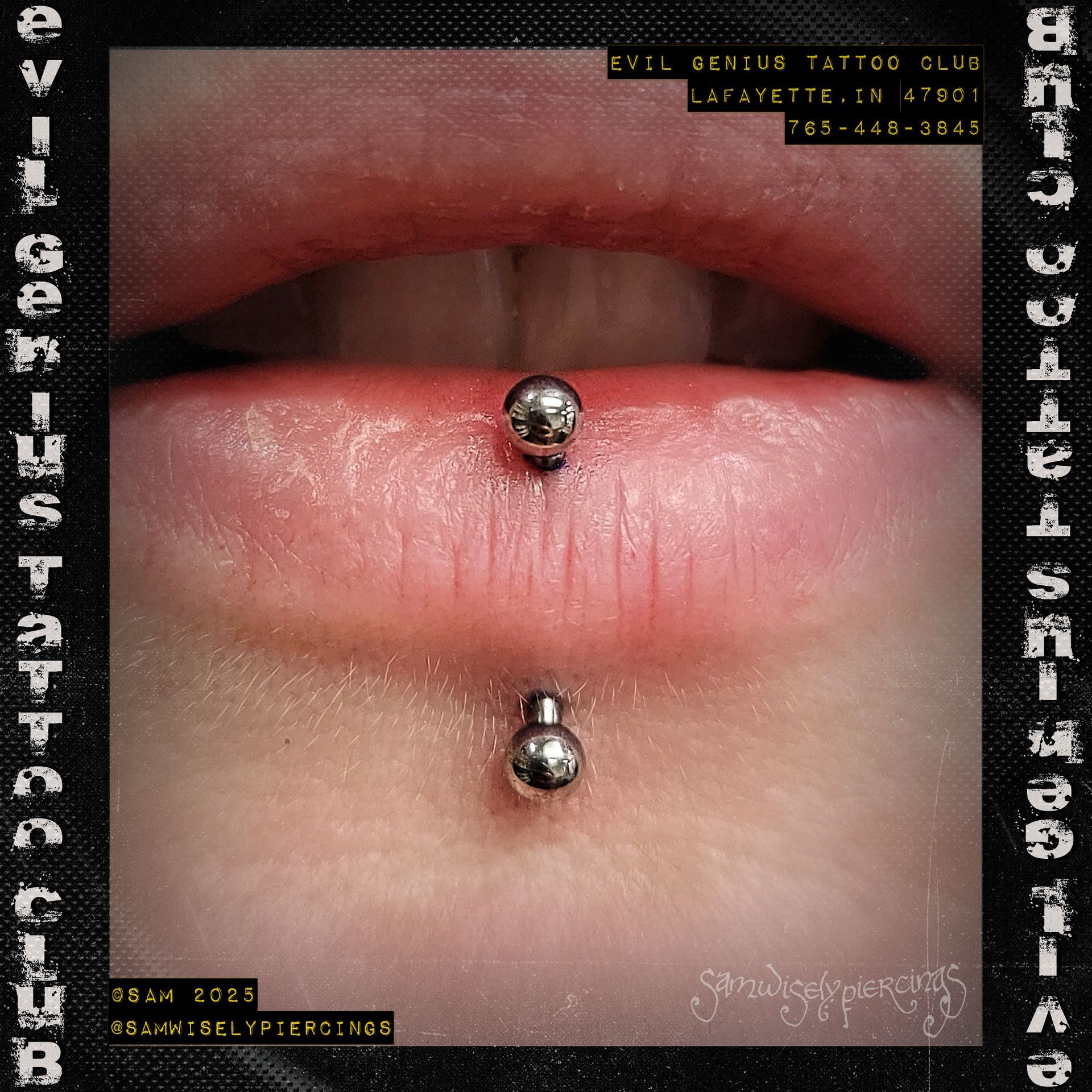 Close-up of a person's lower lip with a vertical piercing performed by Sam.
